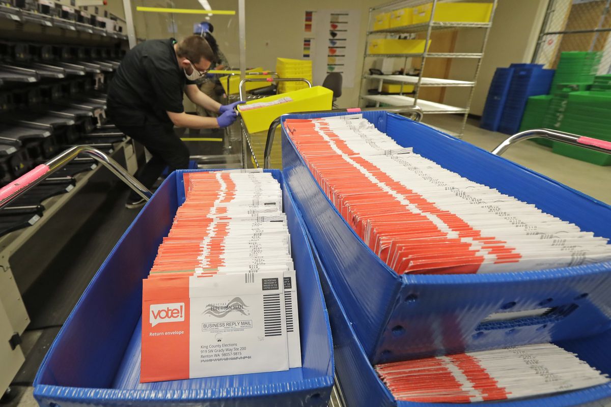 FILE - In this Aug. 5, 2020, file photo, vote-by-mail ballots are shown in sorting trays at the King County Elections headquarters in Renton, Wash., south of Seattle. In every U.S. presidential election, thousands of ballots are rejected and never counted. They may have arrived after Election Day or were missing a voter