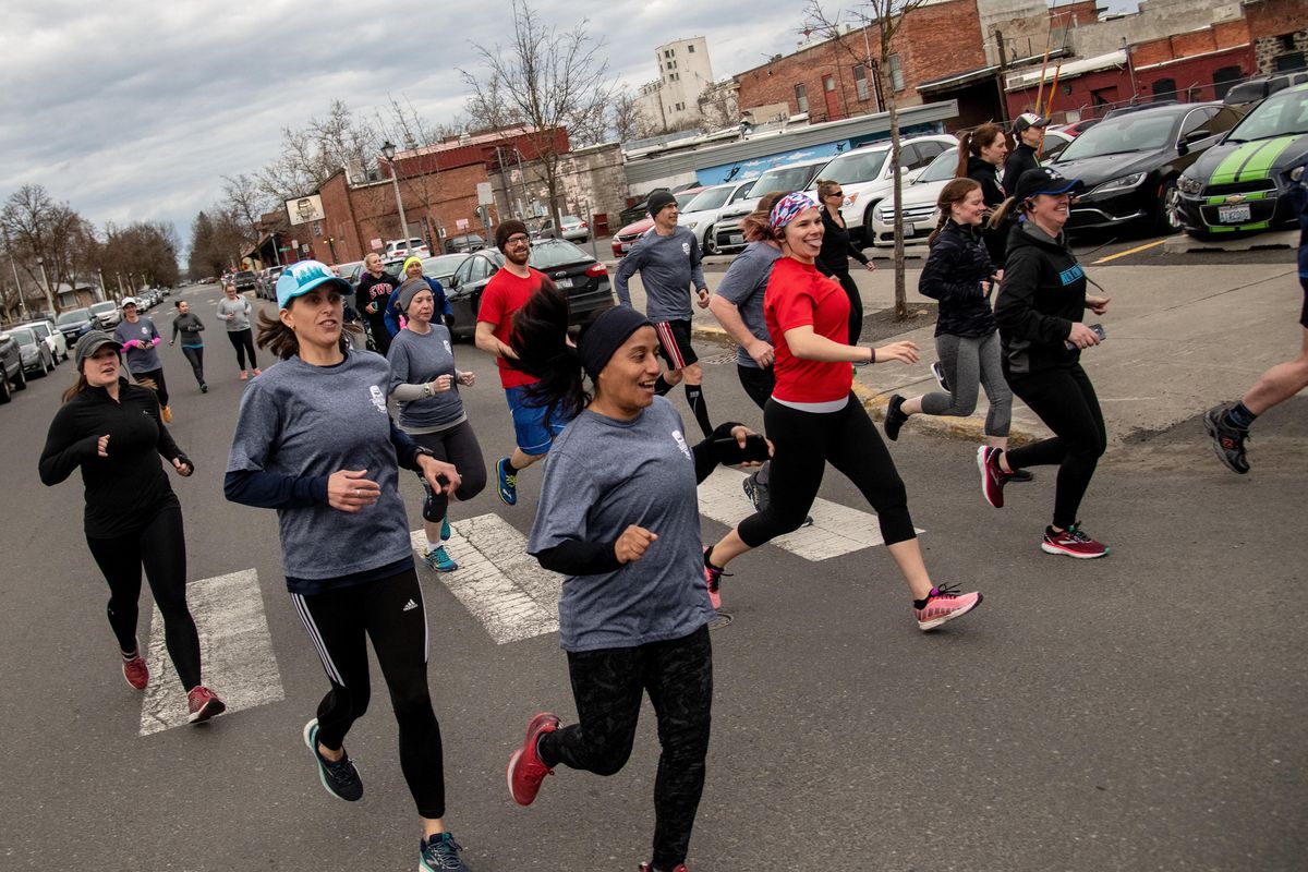 Members of the flightless Birds Running Club start their 3.25 mile run in downtown Cheney, Washington, on Tuesday, April 16, 2019. (Colin Mulvany / The Spokesman-Review)