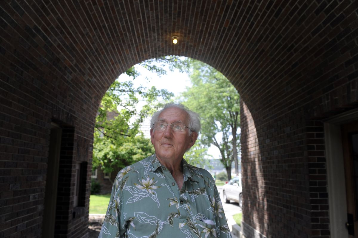 Bob Baker, 83, stands in the shade at the Hutton Settlement, an orphanage in Spokane Valley that celebrated its 90th anniversary Saturday. Baker  lived there from 1935 to 1942 after his mother died from a blood disease and his father died of typhoid fever. (Jesse Tinsley / The Spokesman-Review)
