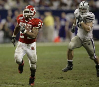 
Rutgers' Ray Rice runs for a 46-yard touchdown as Kansas State's Blake Seiler gives chase.  
 (Associated Press / The Spokesman-Review)