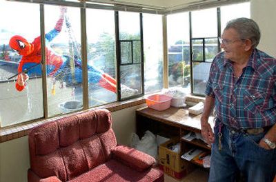 
Roy Wohlford of Medford, Ore., got a big surprise when he looked outside to find Spiderman washing the windows of his fourth floor apartment. Window washer Jay Tyler thought it would be a fun idea to dress up as the superhero. 
 (AP Photo/Medford Mail Tribune, Roy Musitelli / The Spokesman-Review)