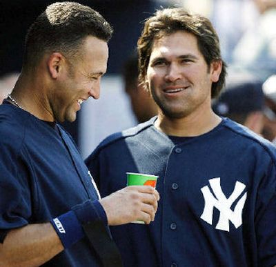 
New York Yankees shortstop Derek Jeter, left, and center fielder Johnny Damon chat in the dugout. 
 (Associated Press / The Spokesman-Review)