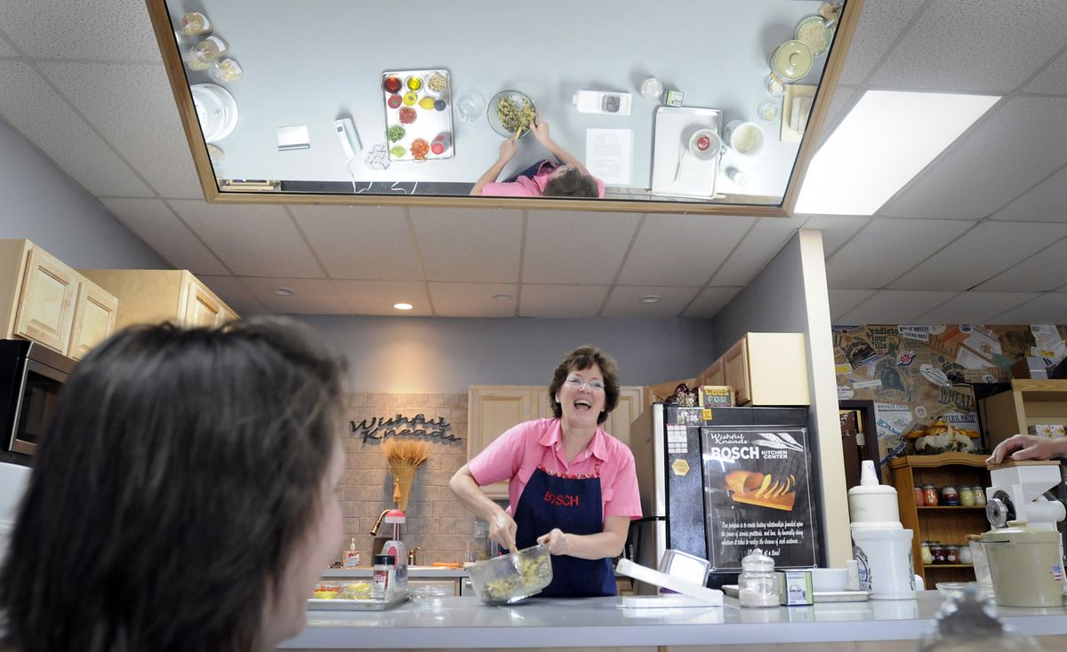 Jan Thornton of Wishful Kneads, a cooking and baking store in the Sunset Mall in Coeur d’Alene, laughs during a recent class in baking with quinoa and amaranth grains.  (Photos by Jesse Tinsley / The Spokesman-Review)