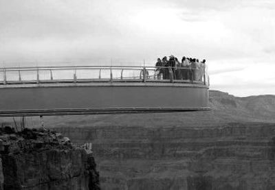 NASA astronaut Buzz Aldrin, Native American NASA astronaut John Bennett Herrington, Las Vegas businessman David Jin and tribal leaders were among the first to walk onto the Grand Canyon Skywalk on the Hualapai Indian Reservation March 20.
(Associated Press / The Spokesman-Review)