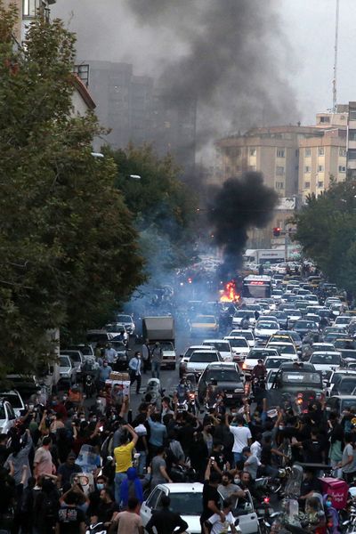 A picture obtained by AFP outside Iran on Sept. 21, 2022, shows Iranian demonstrators taking to the streets of the capital Tehran during a protest for Mahsa Amini, days after she died in police custody.    (AFP/Getty Images North America/TNS)