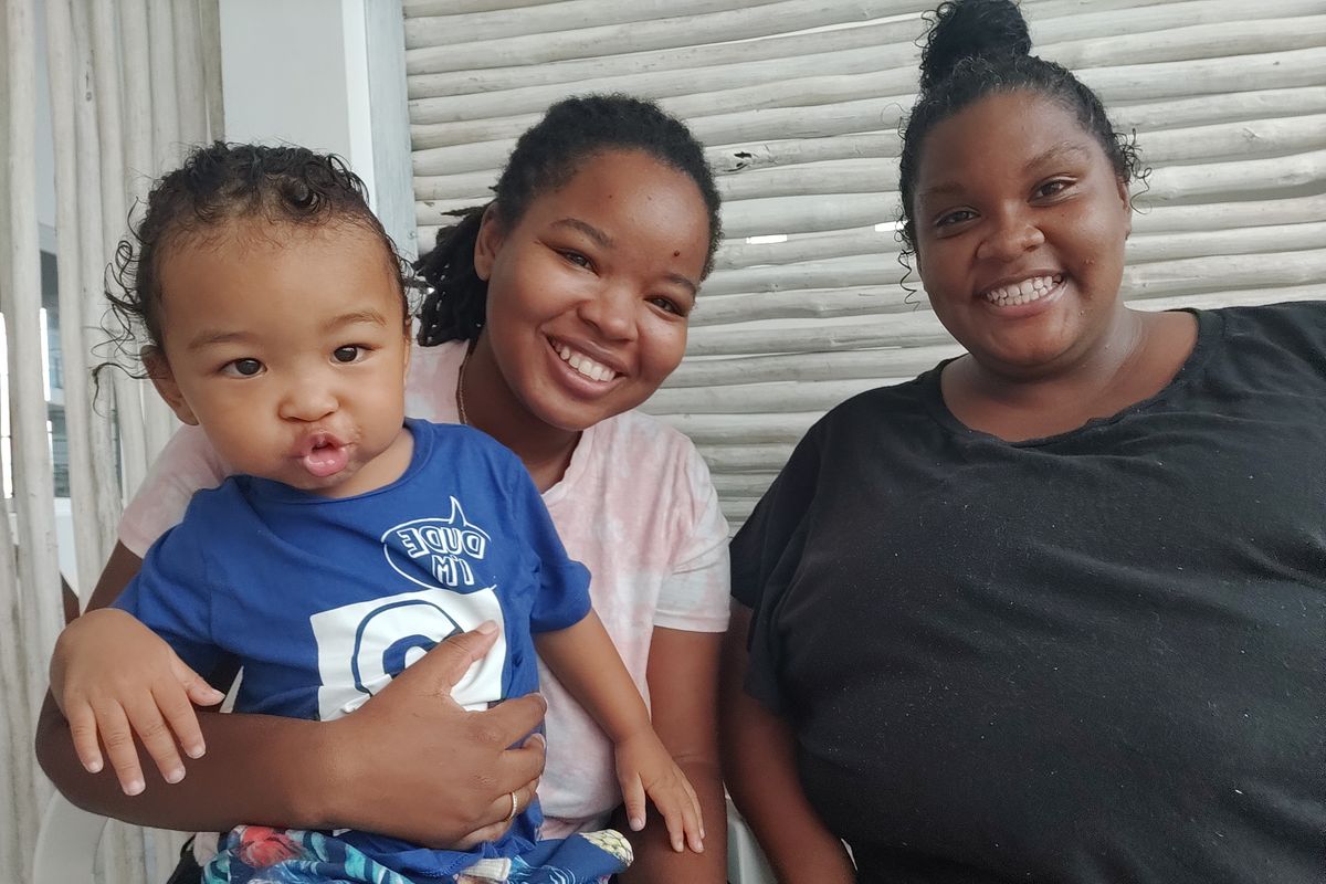 Corritta Lewis and her wife Mea pose with their son Caleb, 2, in Oceanside, Calif., on Dec. 4. Lewis, who has a huge extended family in Ohio, says she is looking forward to staying home with her family and avoiding the overall mania that the holiday brings. (HONS)