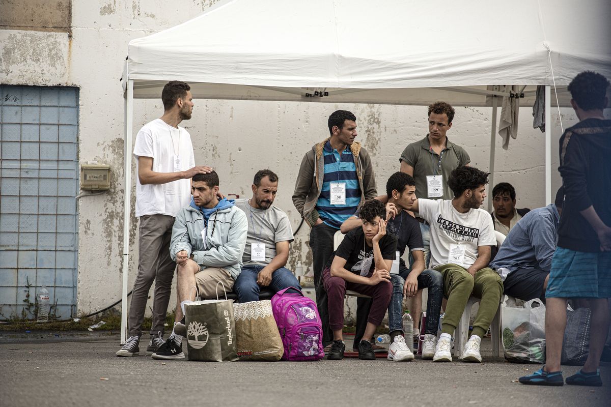 FILE -- Survivors of the Adriana shipwreck wait to be transported to a refugee camp in Kalamata, Greece, June 15, 2023. Satellite images, classified court documents and interviews with survivors show that hundreds of deaths on the migrant ship were preventable. (Eirini Vourloumis/The New York Times)  (EIRINI VOURLOUMIS)