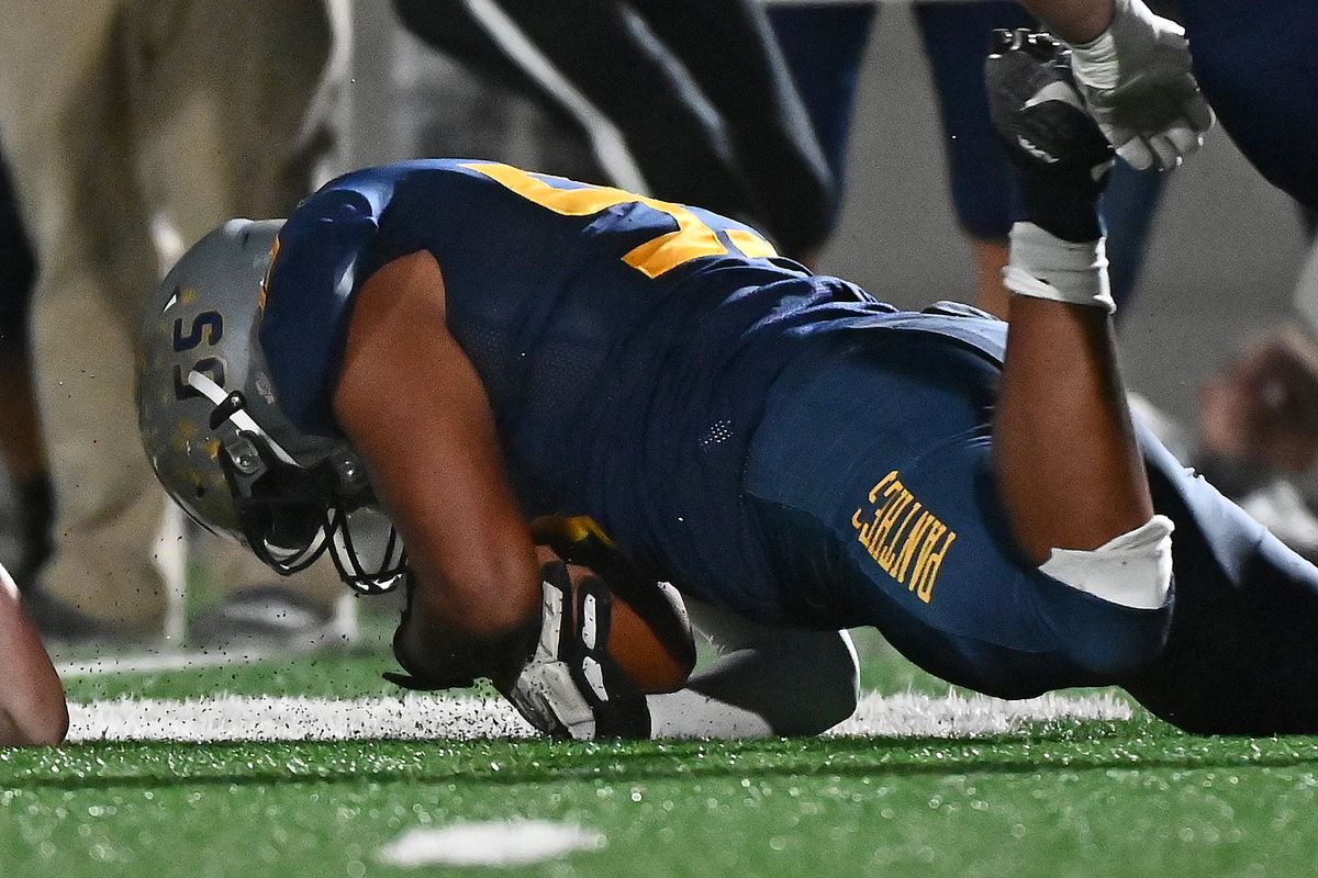 Mead Panthers Sebastien Montout (55) recovers a Gonzaga Prep Bullpups fumble in the first half at Union Stadium on Friday Sept. 23, 2022 in Spokane WA.  (James Snook)