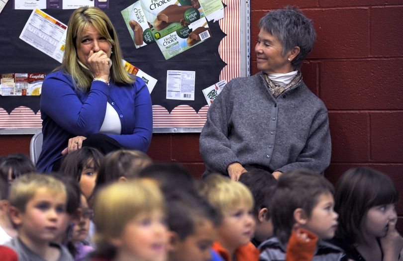 Winton Elementary School 1st grade teacher Erin Lenz, left reacts as she is announced as the 2012 Idaho Teacher of the Year while fellow 1stgrade teacher Ann Porter-Brown looks on. The announcement was given by Superintendent of Public Instruction Tom Luna at the School in Coeur d'Alene on Thursday, November 10,2011. Among the other Coeur d'Alene School District teachers who have been
named Idaho's teacher of the year recently are: Mike Clabby Lake City High School 2007, Paula Conley Canfield Middle School 2005, Patti Perry Skyway Elementary School 2003, Nancy Larsen Ramsey Elementary School 2000 and Judy Bieze Hayden Meadows Elementary School 1999. (Kathy Plonka)