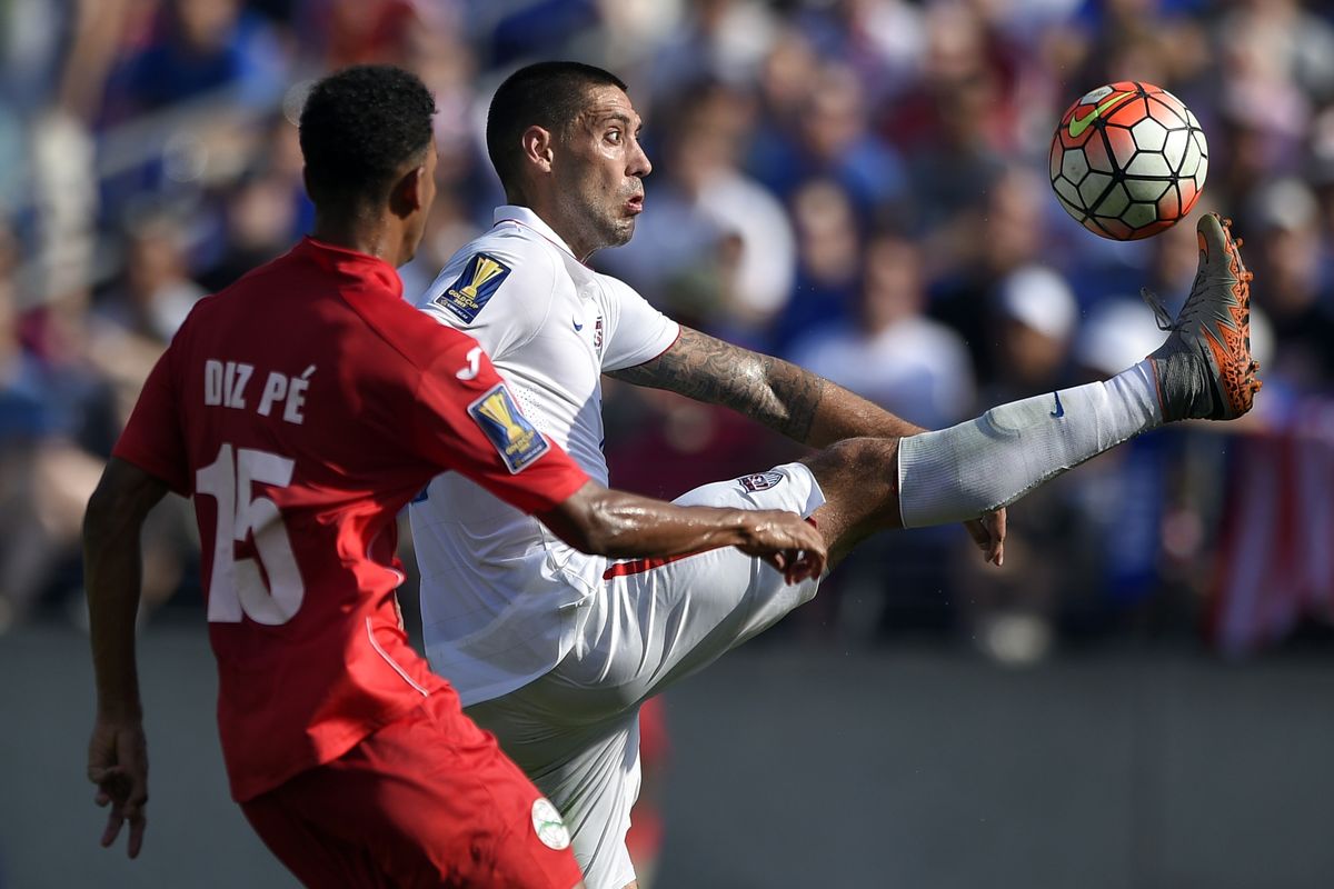 United States forward Clint Dempsey, right, working against Cuba’s Adrian Diz Pe, accounted for three goals during Saturday’s 6-0 win. (Associated Press)