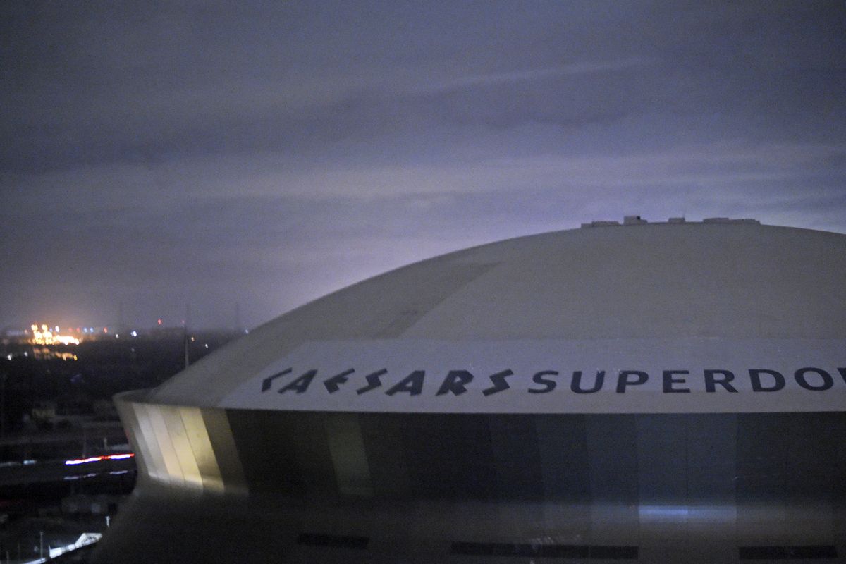 FILE - This early Monday, Aug. 30, 2021, file photo, shows the Caesars Superdome, home of the New Orleans Saints NFL football team in New Orleans, La., after Hurricane Ida. The NFL announced Wednesday, Sept. 1, 2021, that the Saints will host the Green bay Packers in Jacksonville, Fla., in a Sept. 12 season opener after being displaced by Hurricane Ida.  (Max Becherer)