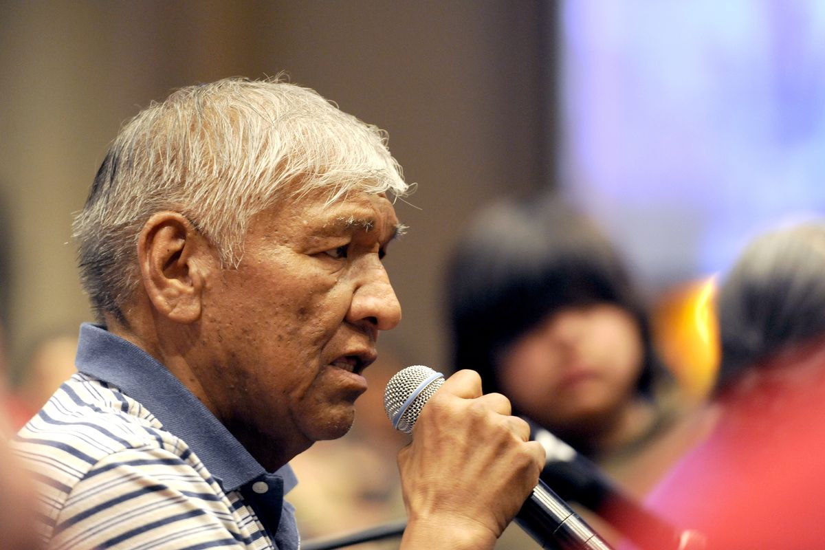 Speaking in Salish, Flathead tribe Elder Alec Quequesah welcomes participants to the Salish conference powwow March 7.