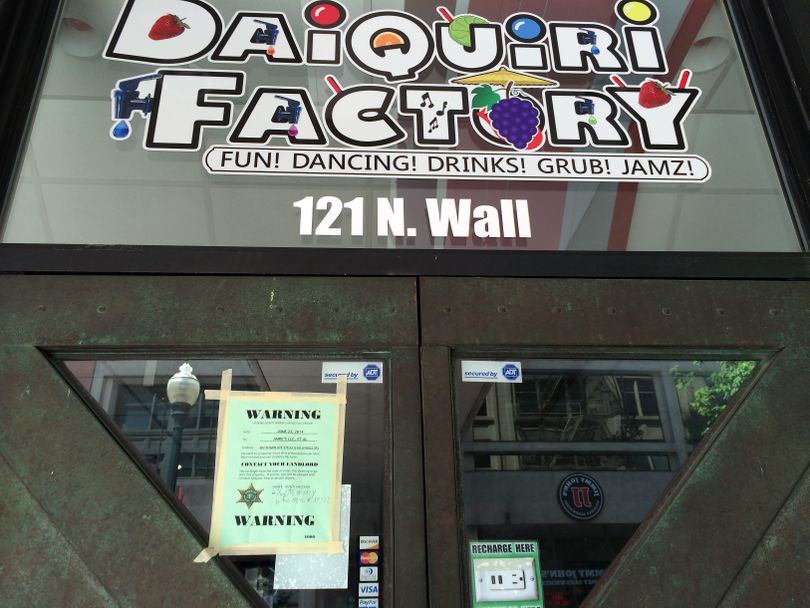 An eviction notice was posted on the doors to the Daiquiri Factory at 121 N. Wall Street on June 23, 2014, in downtown Spokane. (File)