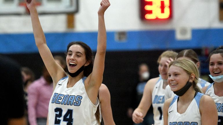 Central Valley’s Chloe Williams (24) celebrates after her Bears defeated Mead 63-60 during the East Region championship game at Central Valley on Wednesday. (Kathy Plonka/The Spokesman-Review)