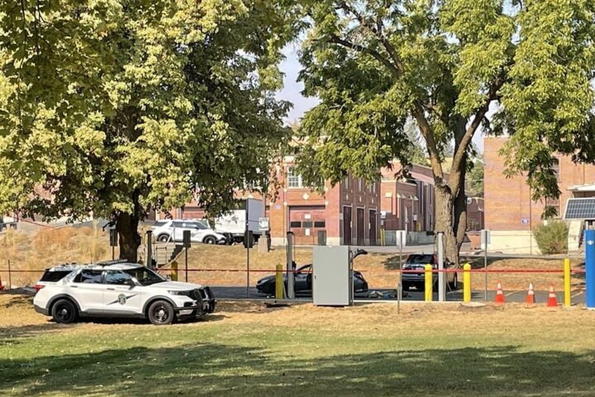 A Washington State Patrol vehicle is parked outside a crime scene Saturday afternoon at Eastern State Hospital where a man is suspected of shooting and killing a hospital employee early that morning before exchanging gunfire with a Spokane County Sheriff