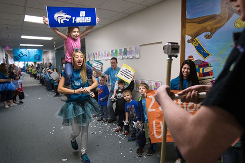 Lake City student carries Betty Kiefer student Peyton Myser while filming a ���lip dub��� video Tuesday at Betty Kiefer Elementary to support a anti-bullying message, create unity between Lake City and Betty Kiefer and support Rachel���s Challenge. Lake City created a similar video in December. (Gabe Green/press)