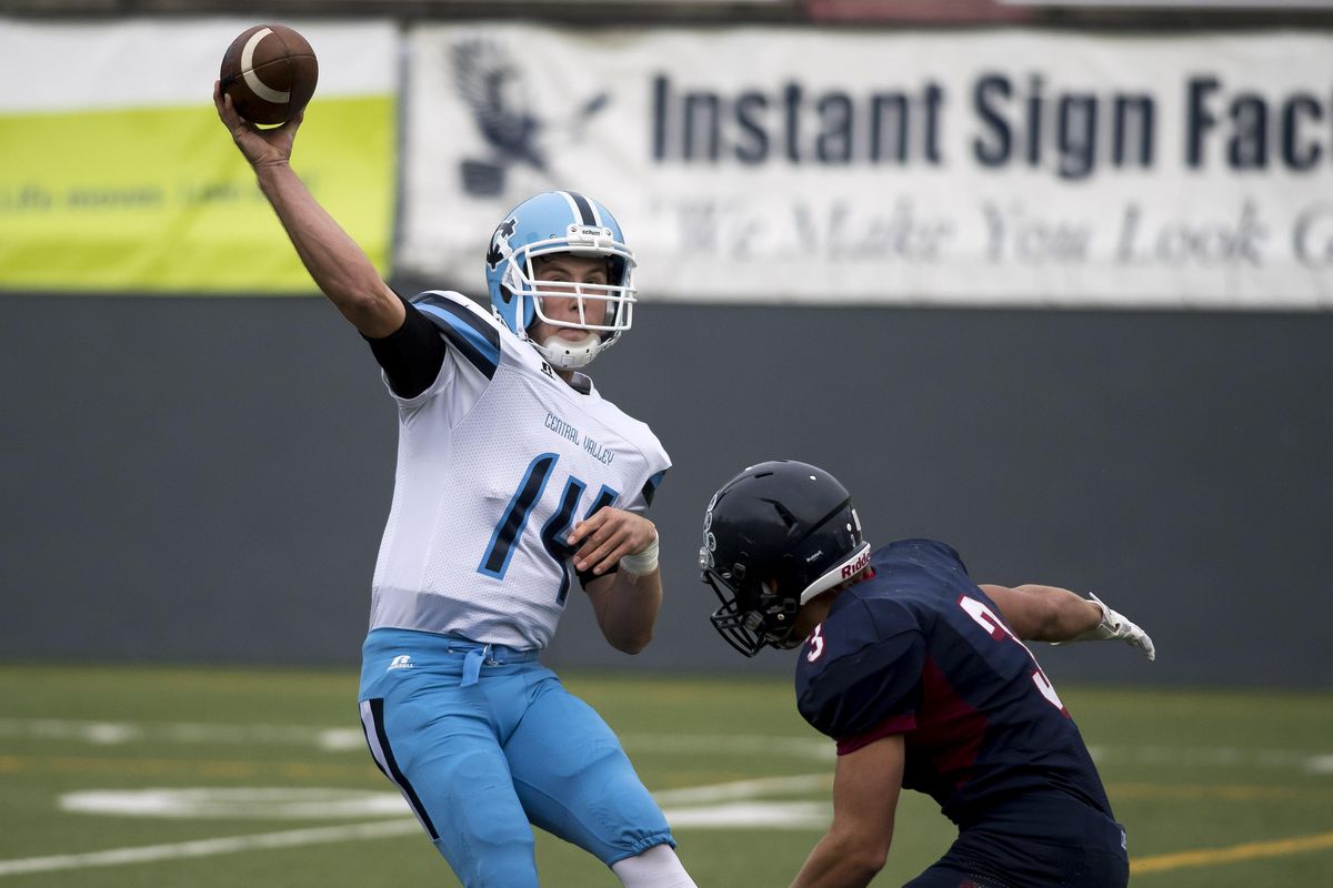 Central Valley quarterback Conner DeGeest (14) throws for 16 yards during the first half of a high school football game at Joe Albi Stadium, Thursday, Sept. 22, 2016. (Colin Mulvany / The Spokesman-Review)