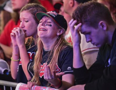 Cleveland Indians fans react as they watch coverage of Game 7 of the baseball World Series outside Progressive Field. (David Dermer / Associated Press)