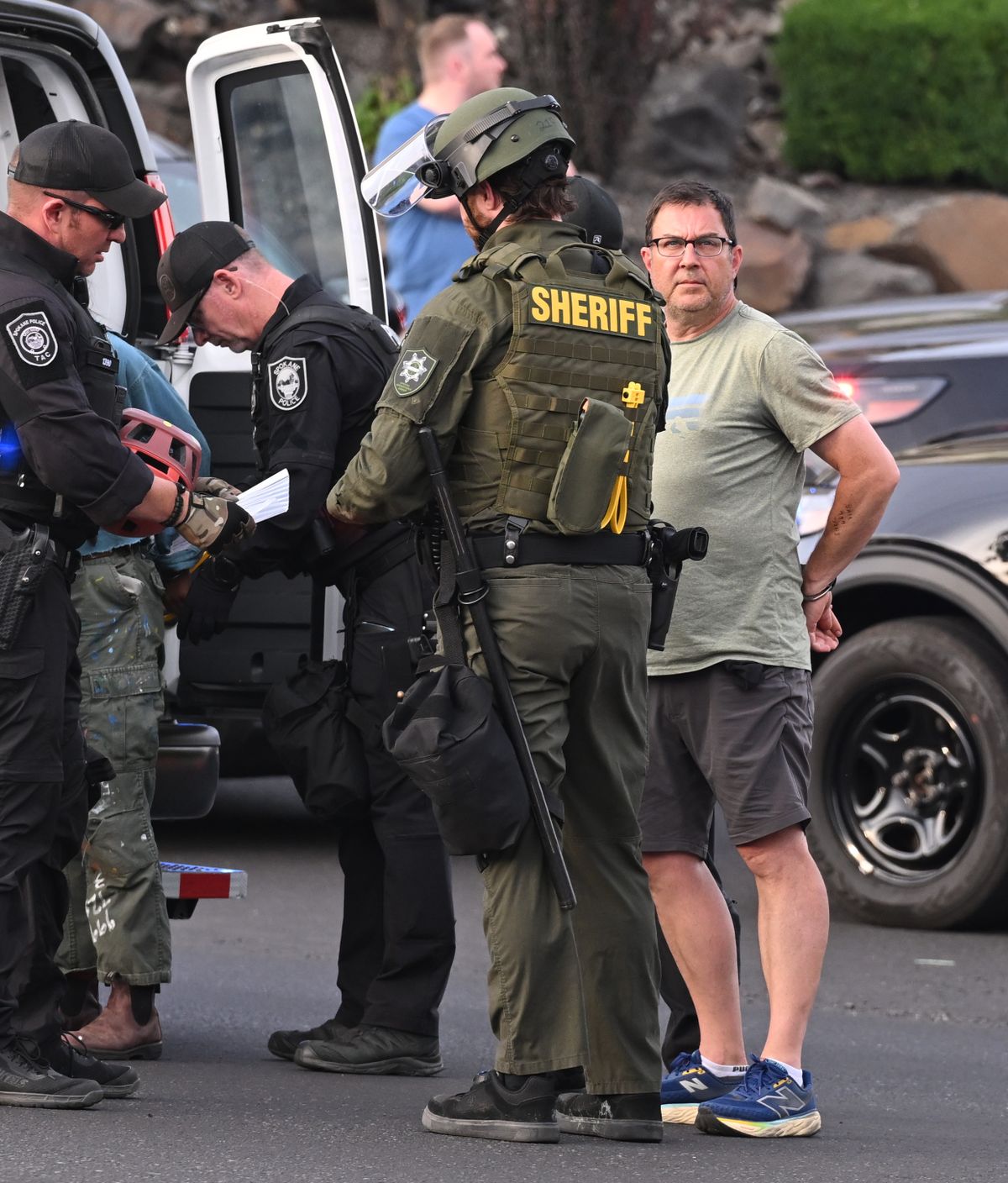 Former Spokane City Council President Ben Stuckart is handcuffed and arrested at an anti-ICE protest around the old Broadview Dairy on the north side of Riverfront Park Wednesday, June 11, 2025. Stuckart’s social media posts about the transfer of people arrested by Immigration and Customs Enforcement agents drew a crowd to the downtown area to challenge the federal authorities.  (Jesse Tinsley/THE SPOKESMAN-REVIEW)