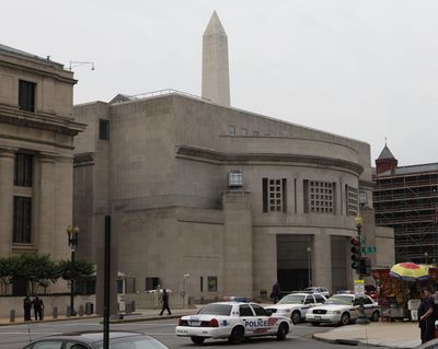 In this June 10, 2009, file photo, the Washington Monument looms over the U.S. Holocaust Memorial Museum in Washington after a James Von Brunn opened fire. Police found anti-Semitic writings justifying the attack in von Brunn’s car. (Charles Dharapak / Associated Press)