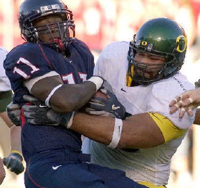 
NFL scouts love the potential of Oregon's Haloti Ngata, right, who is the most impressive physical specimen of the defensive tackles.
 (Associated Press / The Spokesman-Review)
