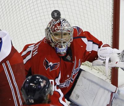 Capitals goalie Michal Neuwirth sees eye-to-eye with puck. (Associated Press)