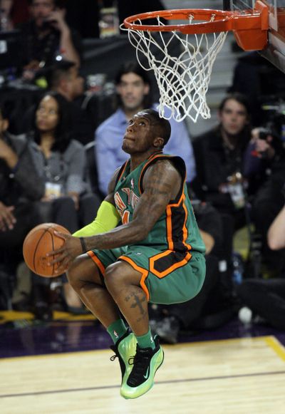 Nate Robinson flew higher than Superman Dwight Howard while winning the NBA’s All-Star slam dunk contest.  (Associated Press / The Spokesman-Review)