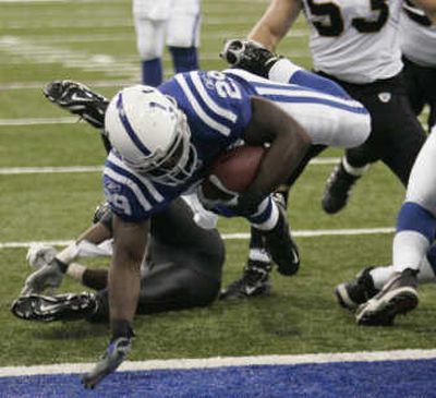 
ason David of the Saints, top, strips the ball from Reggie Wayne on the way to a fumble return for touchdown. Associated Press
 (Associated Press / The Spokesman-Review)