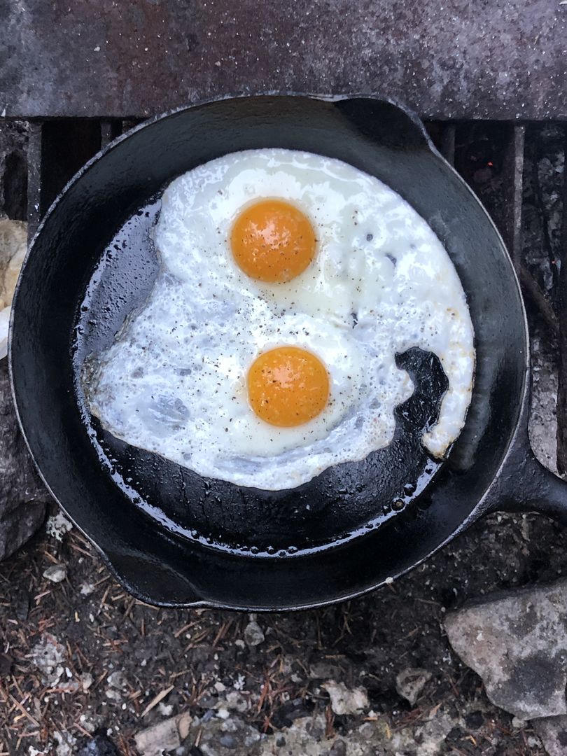 Bacon and eggs over the campfire are a perfect followup to a big day of hiking on Mount Rainier. (Leslie Kelly)