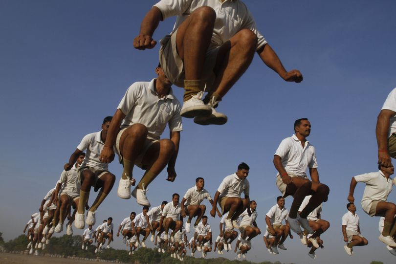 Policemen perform physical exercises at the parade ground in Allahabad, India, Wednesday, June 9, 2010. (Rajesh Singh / Associated Press)