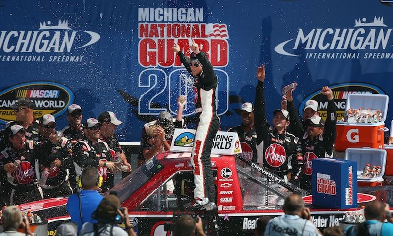 James Buescher, driver of the #31 Rheem Chevrolet, celebrates in Victory Lane after winning the NASCAR Camping World Truck Series 14th Annual Michigan National Guard 200 at Michigan International Speedway on August 17, 2013 in Brooklyn, Michigan. (Photo Credit: Tom Pennington/NASCAR Via Getty Images) (Tom Pennington / Getty Images North America)