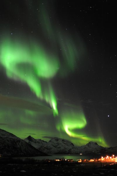The aurora borealis, or northern lights, are seen near the city of Tromsoe in northern Norway late Tuesday after the most powerful solar storm in years. (Associated Press)