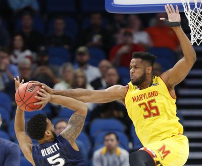 Maryland forward Damonte Dodd (35) blocks a shot from Xavier guard Trevon Bluiett (5) during the first half of the first round of the NCAA college basketball tournament, Thursday, March 16, 2017 in Orlando, Fla. (Wilfredo Lee / Associated Press)