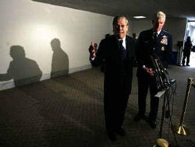 
Secretary of Defense Donald Rumsfeld, left, speaks to reporters as Chairman of the Joint Chiefs Gen. Richard Myers looks on after they testified at the Defense Base Closure and Realignment Commission on Capitol Hill on Monday. 
 (Associated Press / The Spokesman-Review)