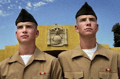 
Mission accomplished: After 13 weeks of basic training, Matt and Robert Shipp are officially U.S. Marines. This picture was taken on family day, Sept. 14, after they received  their pins at theMarine Corps Recruit Depot in San Diego. 
 (Brian Plonka The Spokesman-review / The Spokesman-Review)