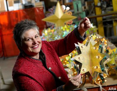 Kathy Presciano, GE Lighting Designer, holds up one of the ornaments for this year's National Christmas Tree. GE Consumer & Industrial has donated the lights and lighting design for the tree since 1962. (Roger Mastroianni / ARA Content)