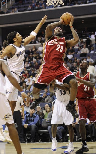 Cleveland’s LeBron James (23) goes to the basket against Washington.  (Associated Press / The Spokesman-Review)