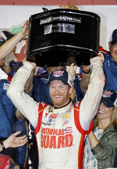 Dale Earnhardt Jr. raises the Daytona 500 trophy for the second time in his career. (Associated Press)