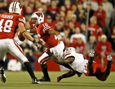 Russell Wilson’s Wisconsin Badgers beat Kirk Cousins and Michigan State for a Big Ten title during their college days. (Andy Manis / Associated Press)