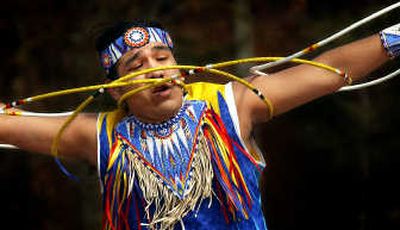
During the 2003 opening ceremony for American Indian Awareness Week, EWU student Ryan Yellowjohn performs a Hoop Dance.
 (File / The Spokesman-Review)