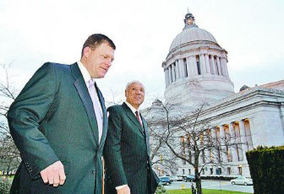 
Seattle SuperSonics owner Clay Bennett, left, walks with Sonics vice-chairman Lenny Wilkins at the Capitol in Olympia.
 (Associated Press / The Spokesman-Review)