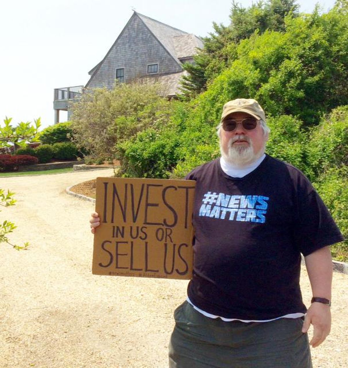 Evan Brandt, a reporter for the Pottstown Mercury in Pennsylvania, protests outside the vacation home of Heath Freeman in May 2018. (Courtesy of Lorraine Dusky / Courtesy of Lorraine Dusky)