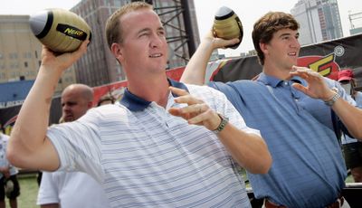 Peyton and Eli Manning, right, were voted to the Pro Bowl – the first time quarterback-playing brothers were picked for the same all-star game. (Associated Press / The Spokesman-Review)