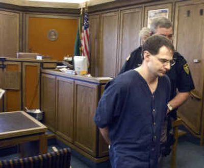 
Raymond Carl Hughes is taken back to jail after appearing in front of Superior Court Judge Jerome Leveque on Wednesday.  
 (Christopher Anderson/ / The Spokesman-Review)