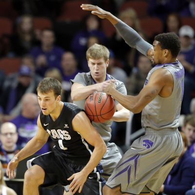 Kansas State's Will Spradling, middle, and Shane Southwell, strip the ball from Gonzaga's Kevin Pangos during the first half of an NCAA college basketball game in Wichita, Kan., on Saturday. (Associated Press)