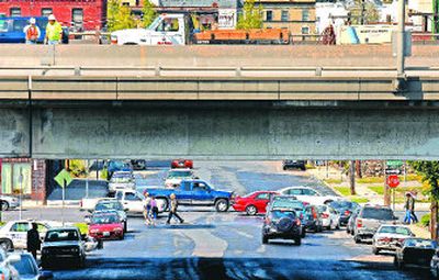 
Traffic slowly moves down Third Avenue in Spokane on Monday as cars wait to turn from Bernard Street and crews work on Interstate 90 above. Most of the downtown highway on-ramps and exits are closed during viaduct construction. 
 (Jed Conklin / The Spokesman-Review)