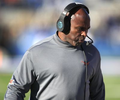 Texas head coach Charlie Strong walks the sideline during the first half of a 24-21 loss to Kansas in Lawrence, Kansas, Saturday, Nov. 19, 2016. Longhorns athletic director Mike Perrin said Strong will be evaluated after playing TCU on Friday. (Orlin Wagner / Associated Press)