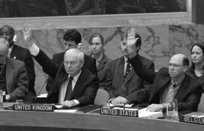 
U.S. Ambassador Alejandro Wolff joins British Ambassador Emyr Jones Parr as the U.N. Security Council votes to expand sanctions against Iran Saturday. 
 (Associated Press / The Spokesman-Review)