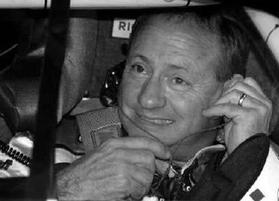 
Ken Schrader adjusts his radio earplugs during practice for Saturday's race. 
 (Associated Press / The Spokesman-Review)