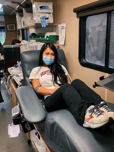 North Idaho College engineering student Hang Wiggins rests in Vitalant’s mobile blood donation bus after giving blood Jan. 25 at the college’s main campus in Coeur d’Alene.  (Photo courtesy of Elli Oba, North Idaho College)